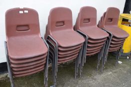 Quantity of brown plastic stacking chairs, approx 24