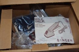 A Magic Tailor hole and tear mender, boxed