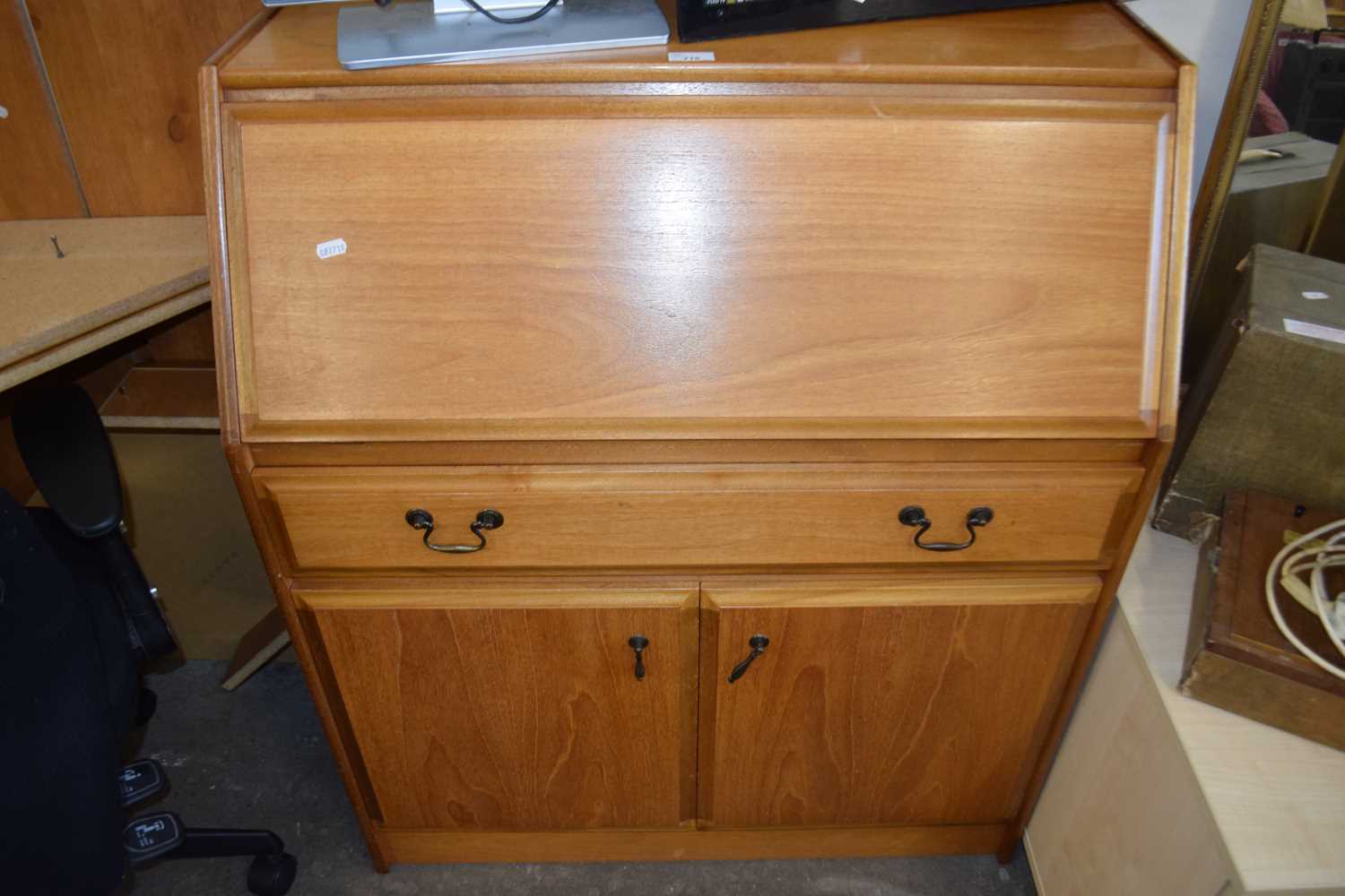 Drop leaf bureau cabinet with single drawer and cupboards below