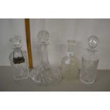 Four clear glass decanters