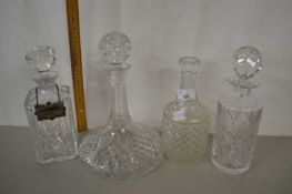 Four clear glass decanters