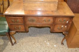 Reproduction walnut veneered five drawer desk or dressing table on cabriole legs, 105cm wide
