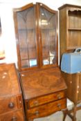 An early 20th Century walnut veneered bureau bookcase cabinet, 61cm wide