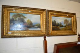 A pair of early 20th Century studies of riverside cottages, oil on board, gilt framed