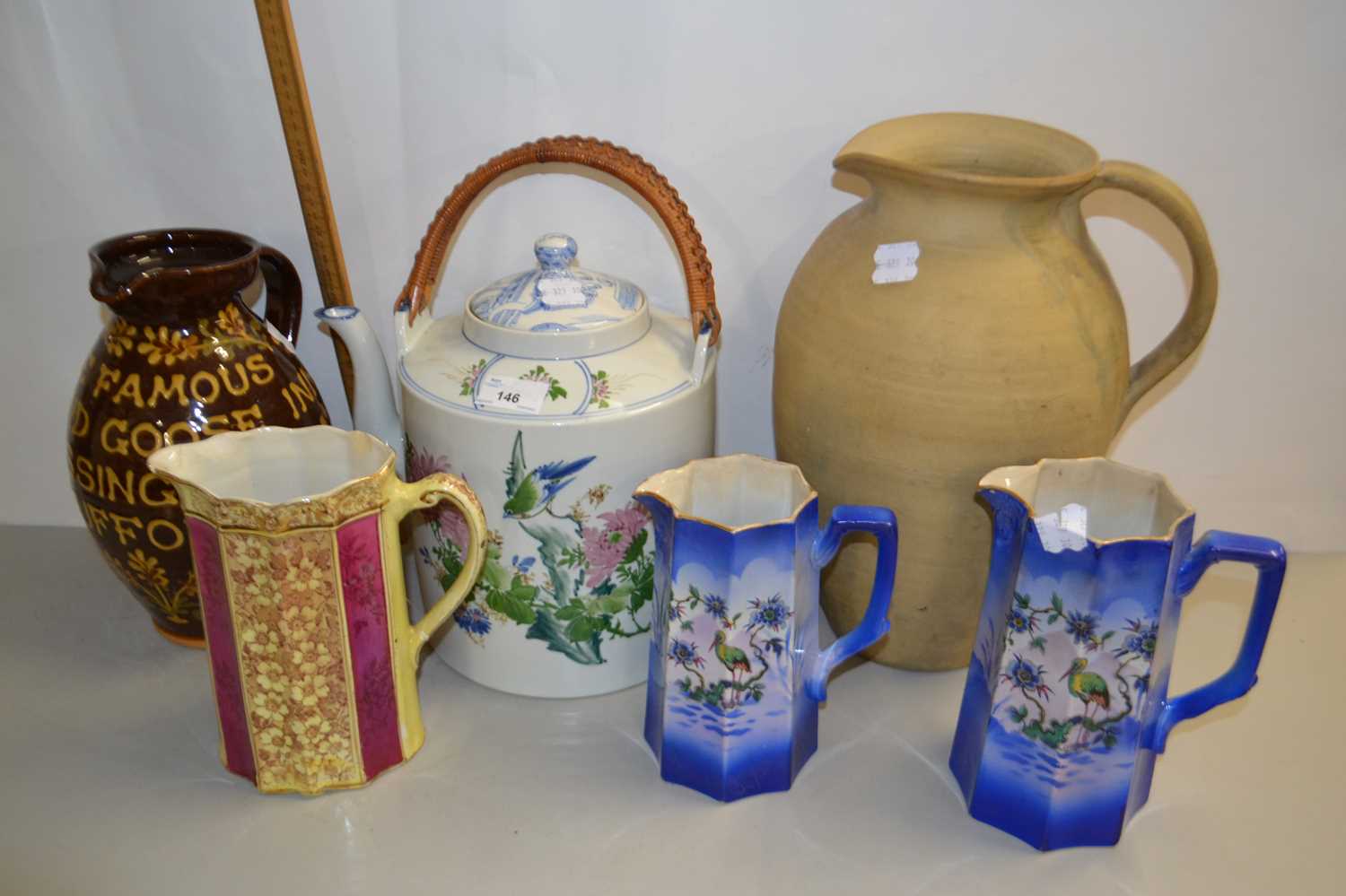 Mixed Lot: Modern Oriental kettle, various jugs to include a pottery jug marked The Famous Fox &