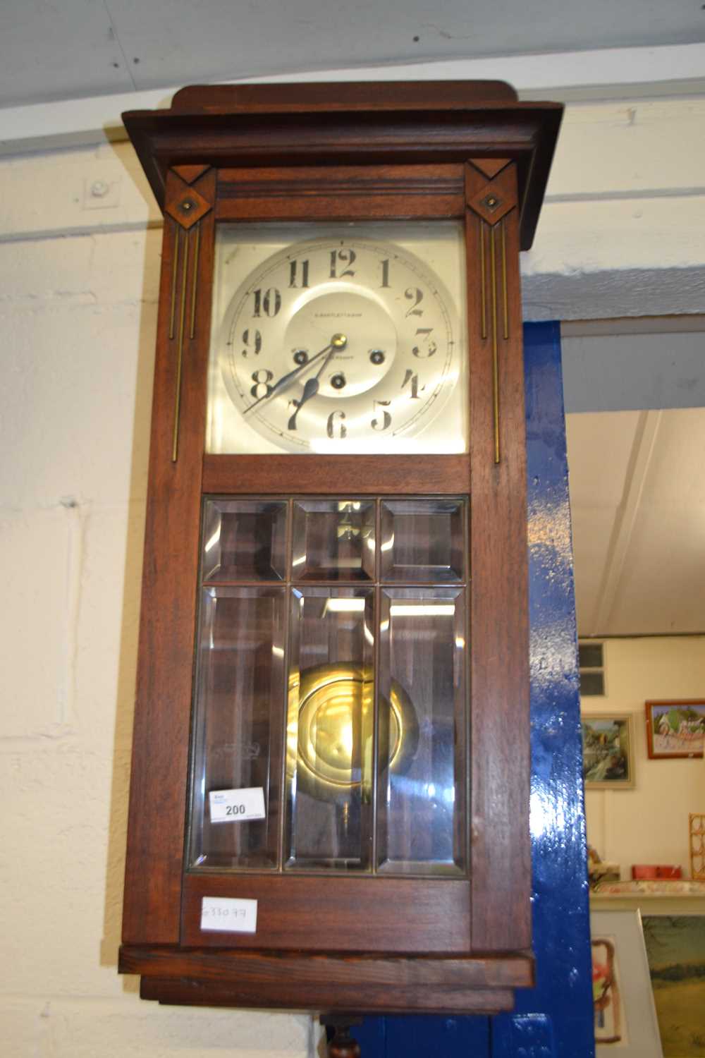 An early 20th Century mahogany cased wall clock, marked Bartlett & Son, Aldershot