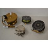 Brass centre pin fishing reel marked Mallochs Patent together with a further centre pin reel and a