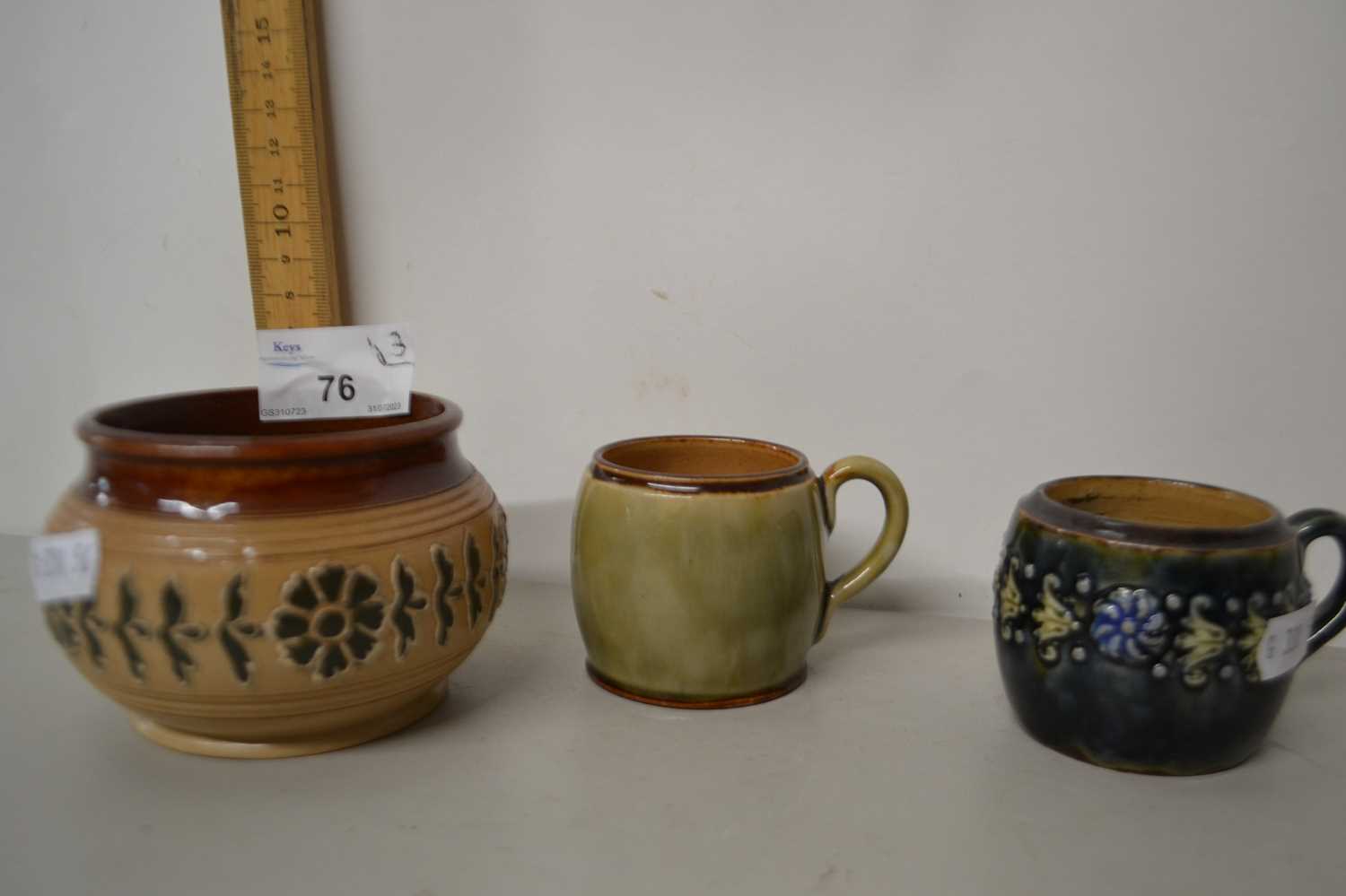 Two small Royal Doulton cups together with a further small circular pot (3)