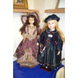 Two reproduction porcelain headed dolls