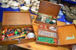 Three vintage wooden cases containing an assortment of various fishing tackle to include a range