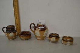 Collection of Doulton stone ware condiment pots and small jugs