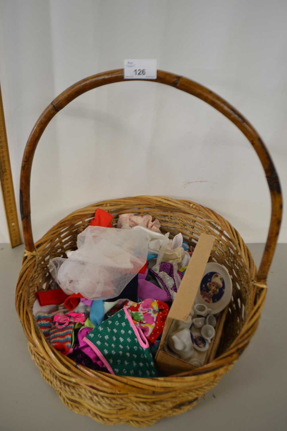 Basket of various dolls clothes