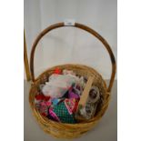 Basket of various dolls clothes