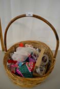 Basket of various dolls clothes
