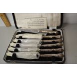 A case of six silver handled and steel bladed Sheffield butter knives