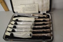 A case of six silver handled and steel bladed Sheffield butter knives