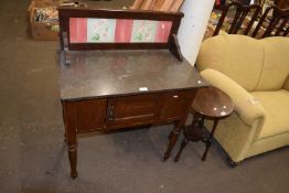 An Edwardian wash stand with tile back and marble top