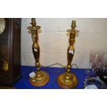 Pair of brass and wooden based table lamps