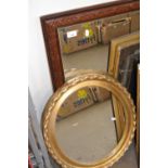 An oval framed wall mirror and a rectangular framed wall mirror (2)