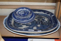 Two blue and white meat plates together with a small quantity of other blue and white