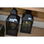 Two battery operated storm lanterns