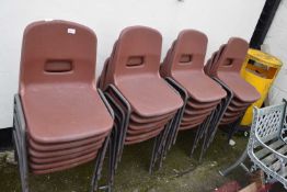 Quantity of brown plastic stacking chairs, approx 24