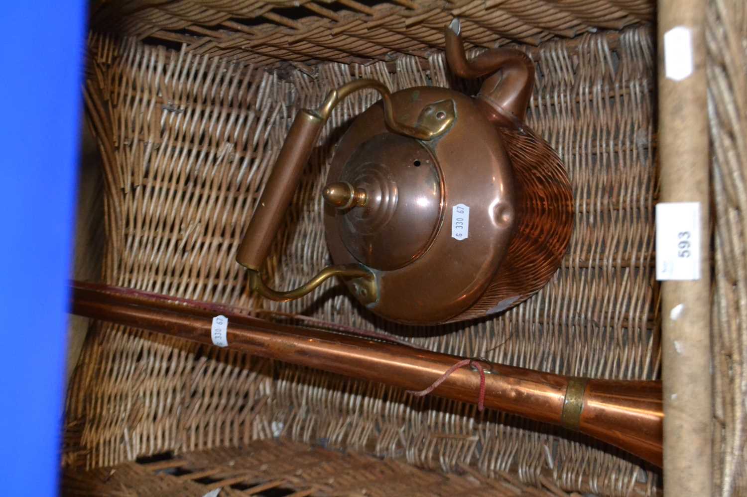 Wicker basket together with a copper hunting horn and copper kettle