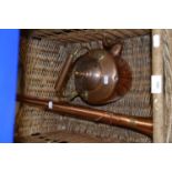 Wicker basket together with a copper hunting horn and copper kettle