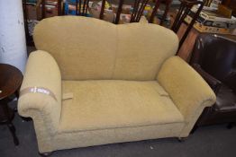 A two seater yellow sofa