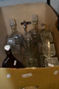 A three bottle tantalus together with quantity of assorted decanters