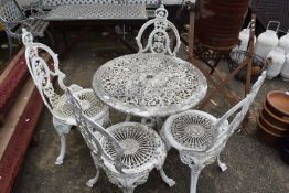 A white painted cast garden table and four chairs