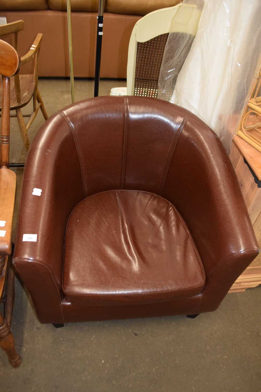 A brown tub chair