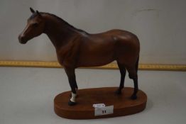 A Beswick model of a thoroughbred racehorse on plinth base