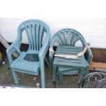 Mixed plastic garden chairs and table