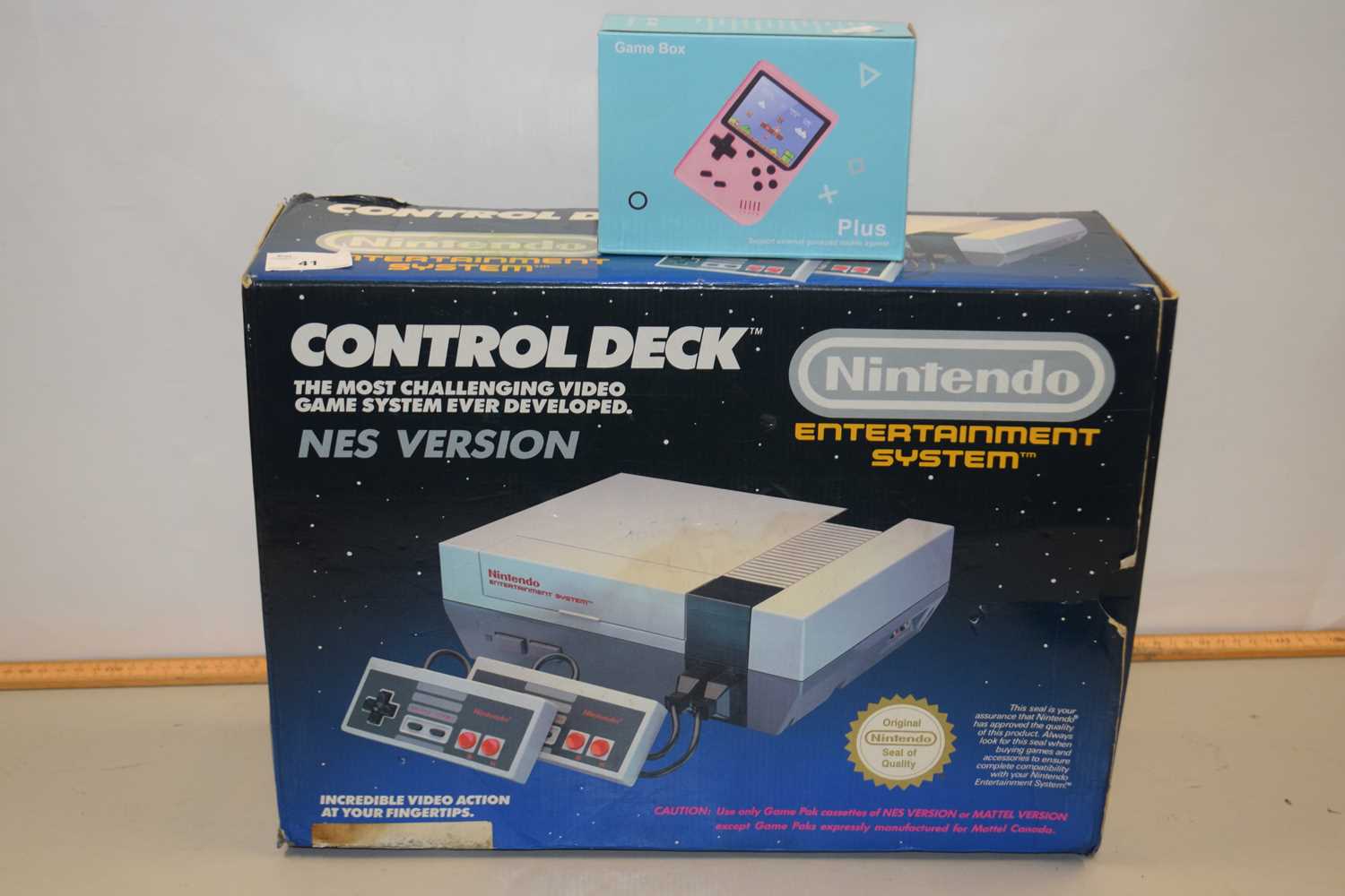 Nintendo NES control deck together with a further game box