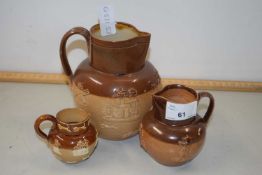 Two Royal Doulton stone ware harvest type jugs and a similar condiment pot (3)