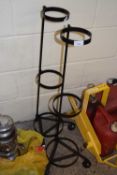 Two metal plant pot stands