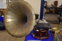 A gramophone with brass horn together with a case of records