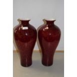 A pair of red Art Glass vases
