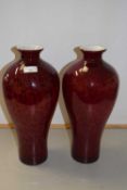 A pair of red Art Glass vases