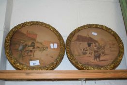 A pair of circular framed studies, village scenes with horses and carts