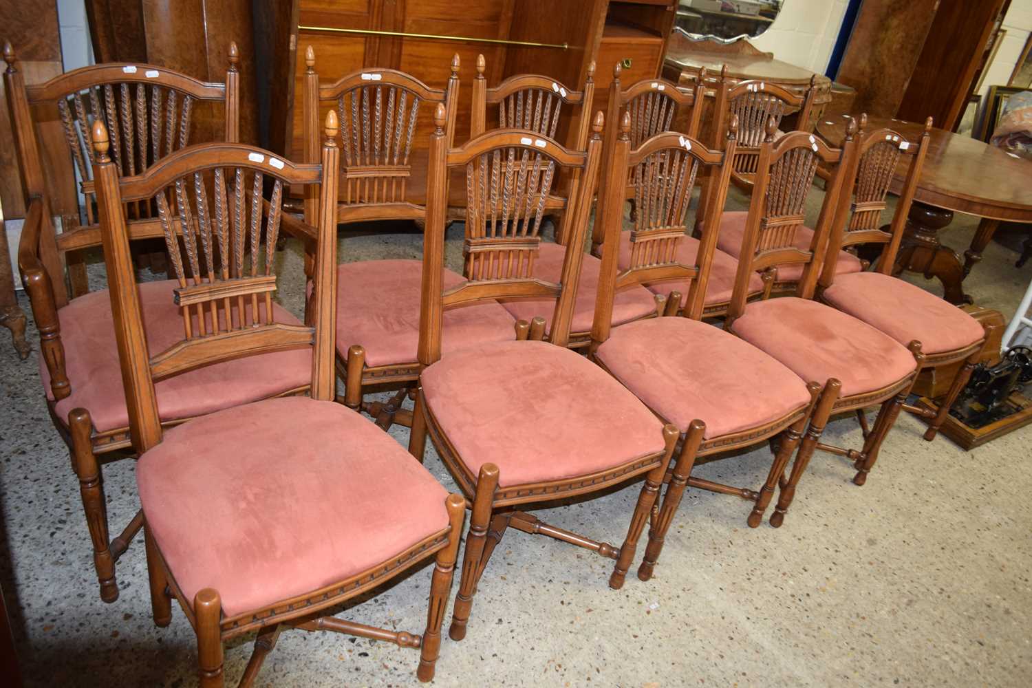 Ten reproduction dining chairs with red upholstered seats