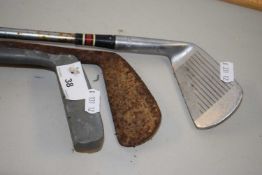 Three assorted vintage golf clubs