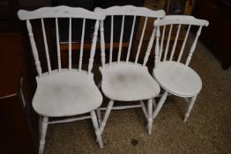 Three white painted kitchen chairs