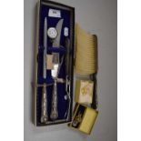 Mixed Lot: A silver handled carving set, a small silver pocket watch, a silver gilt brooch, a