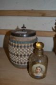 Royal Doulton tobacco jar with white metal lid together with a gilt painted scent bottle with