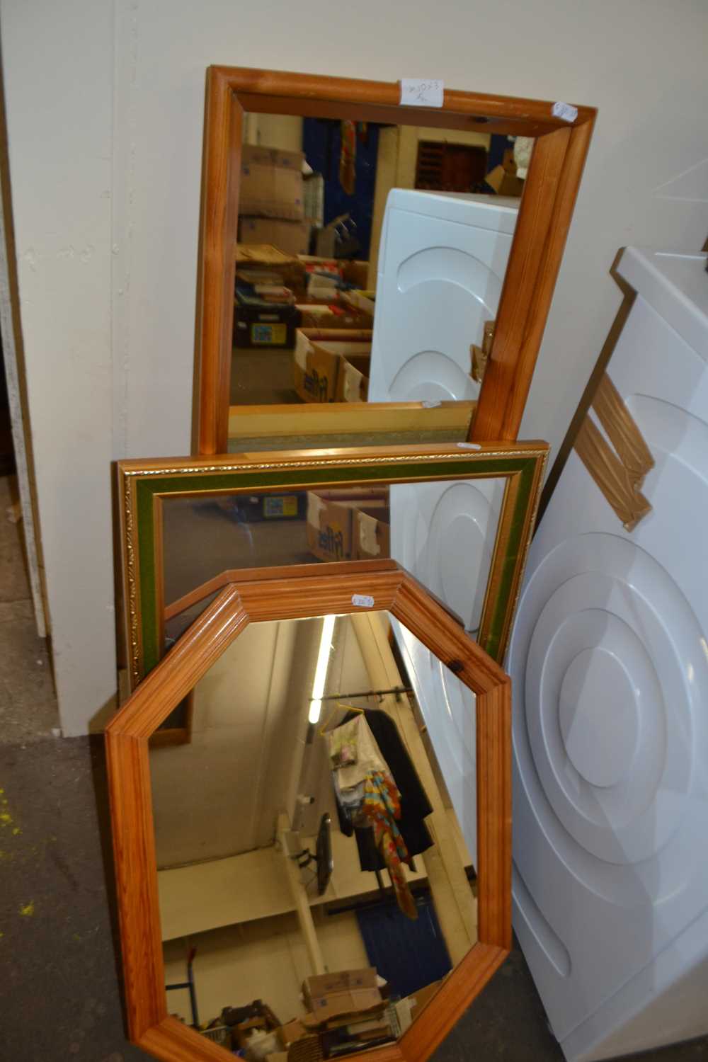 Two pine framed wall mirrors together with another green and gilt framed wall mirror