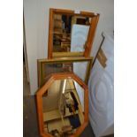 Two pine framed wall mirrors together with another green and gilt framed wall mirror