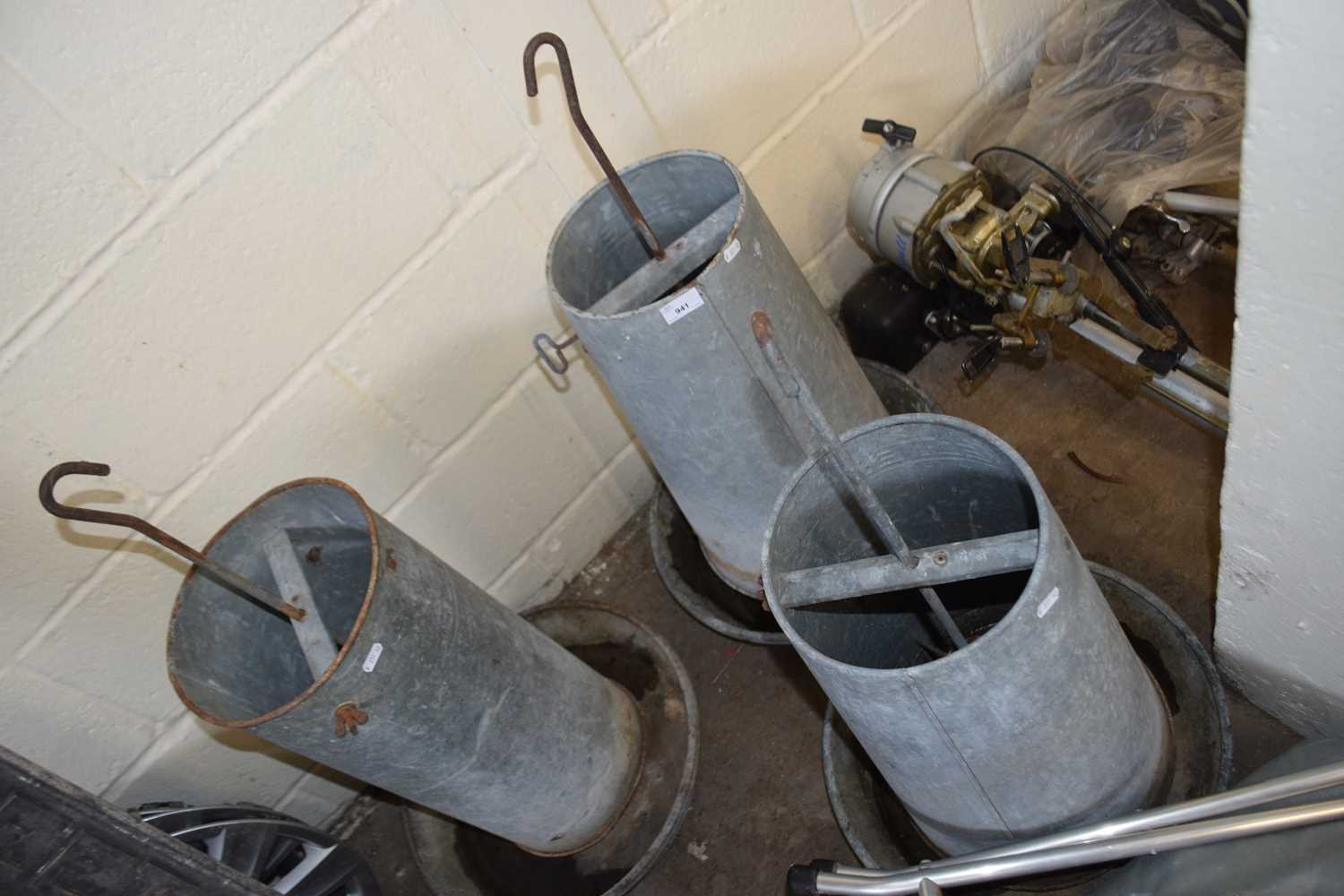 Three metal poultry feeders