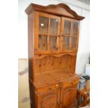 Pine dresser with glazed door above, drawers and cupboard below approx 88 cm wide